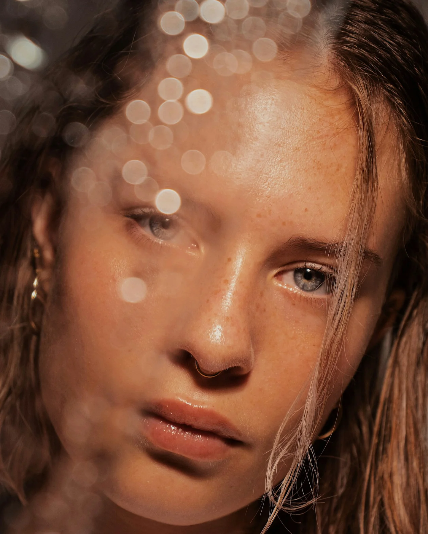 Close-up portrait with natural skin texture in warm sunlight